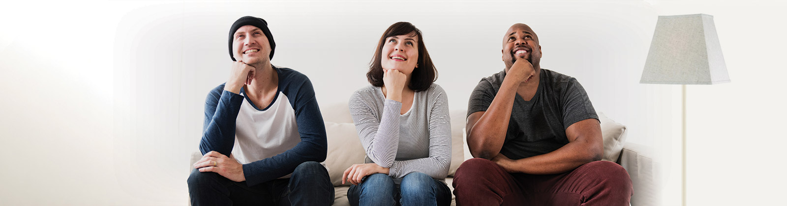 Group of young people sitting looking up