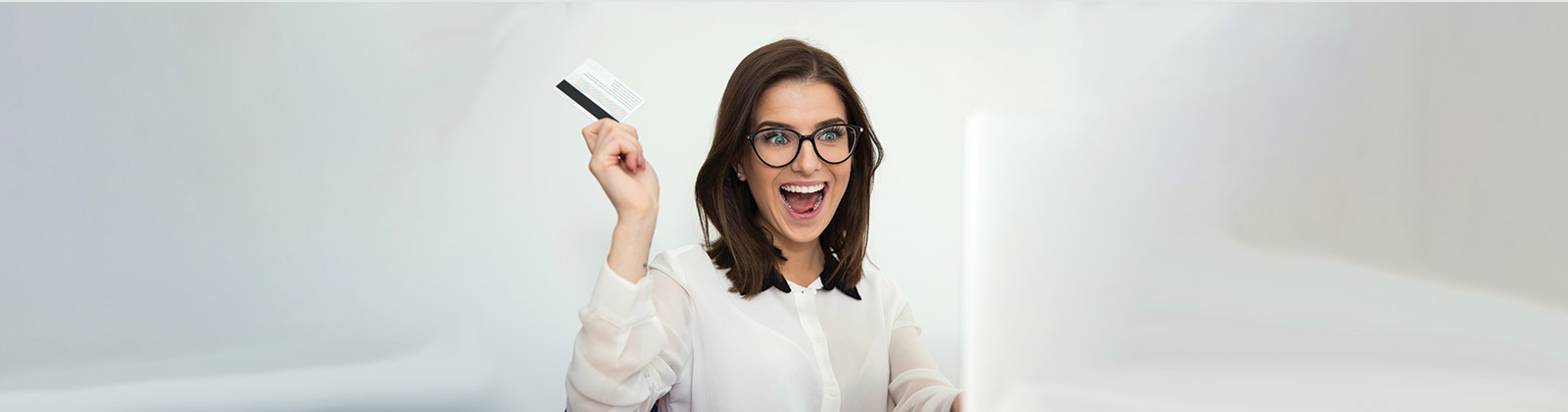 Woman in glasses with credit card 